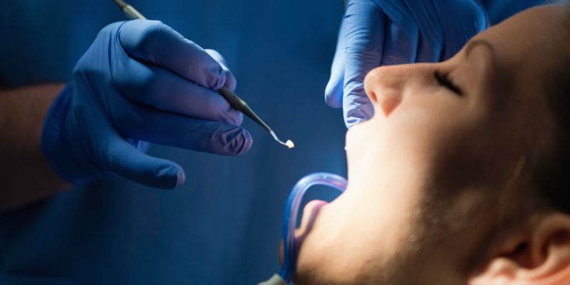 dentist working on the mouth of a patient