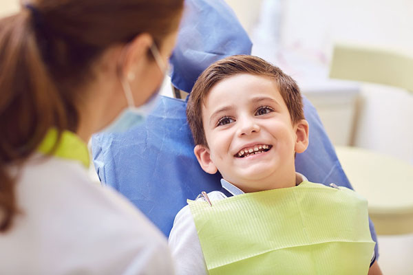 young boy smiling during his dental visit